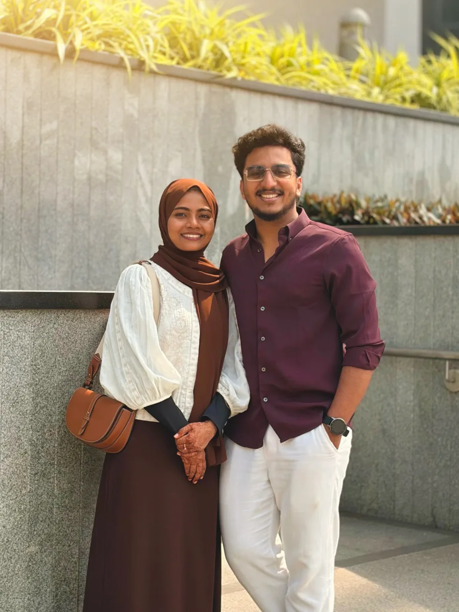 A smiling couple enjoying a bright outdoor moment